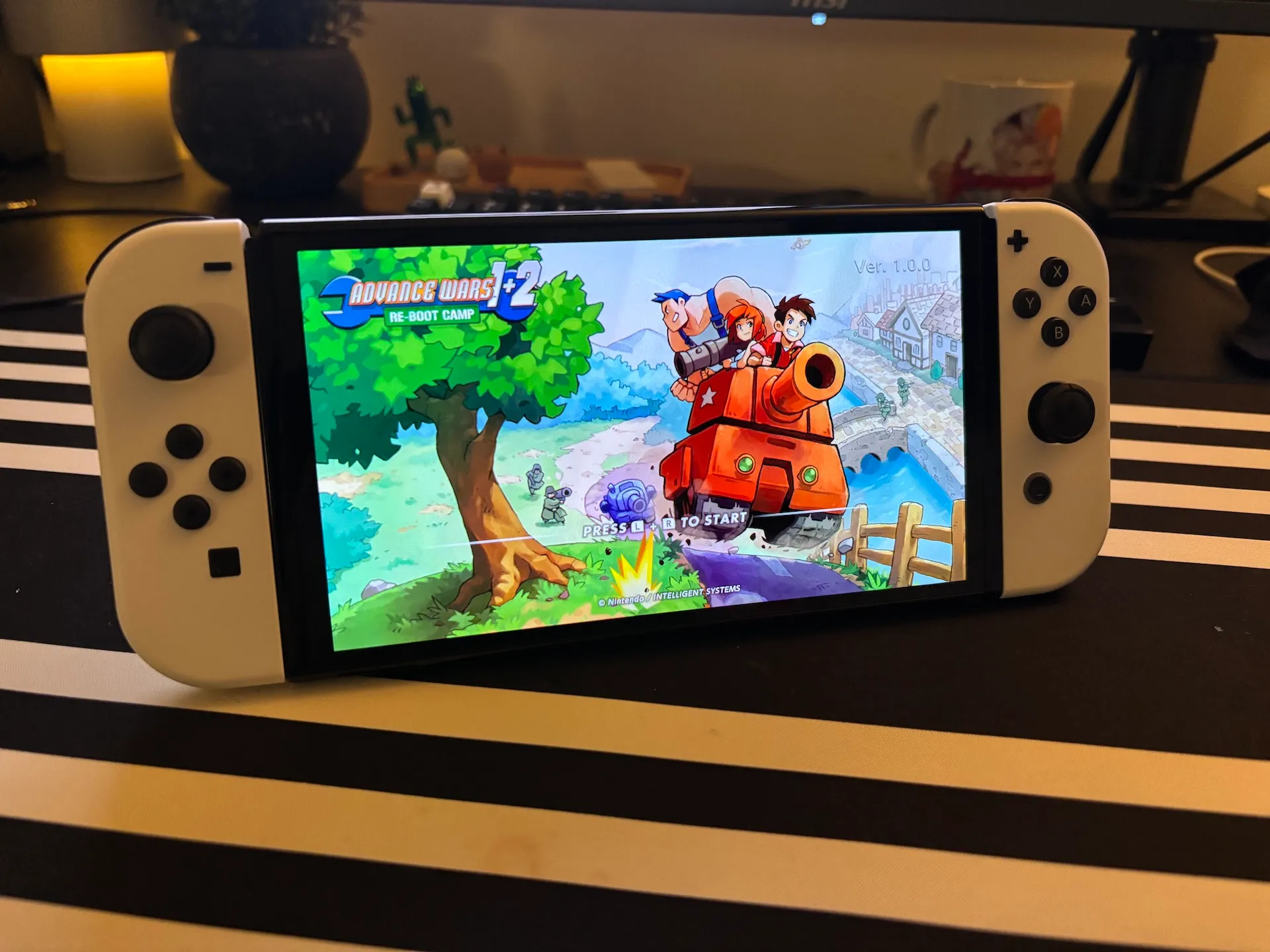 Nintendo Switch OLED with Advance wars 1+2 Reboot camp start screen.